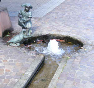 Hausach - statue and stream on pavement